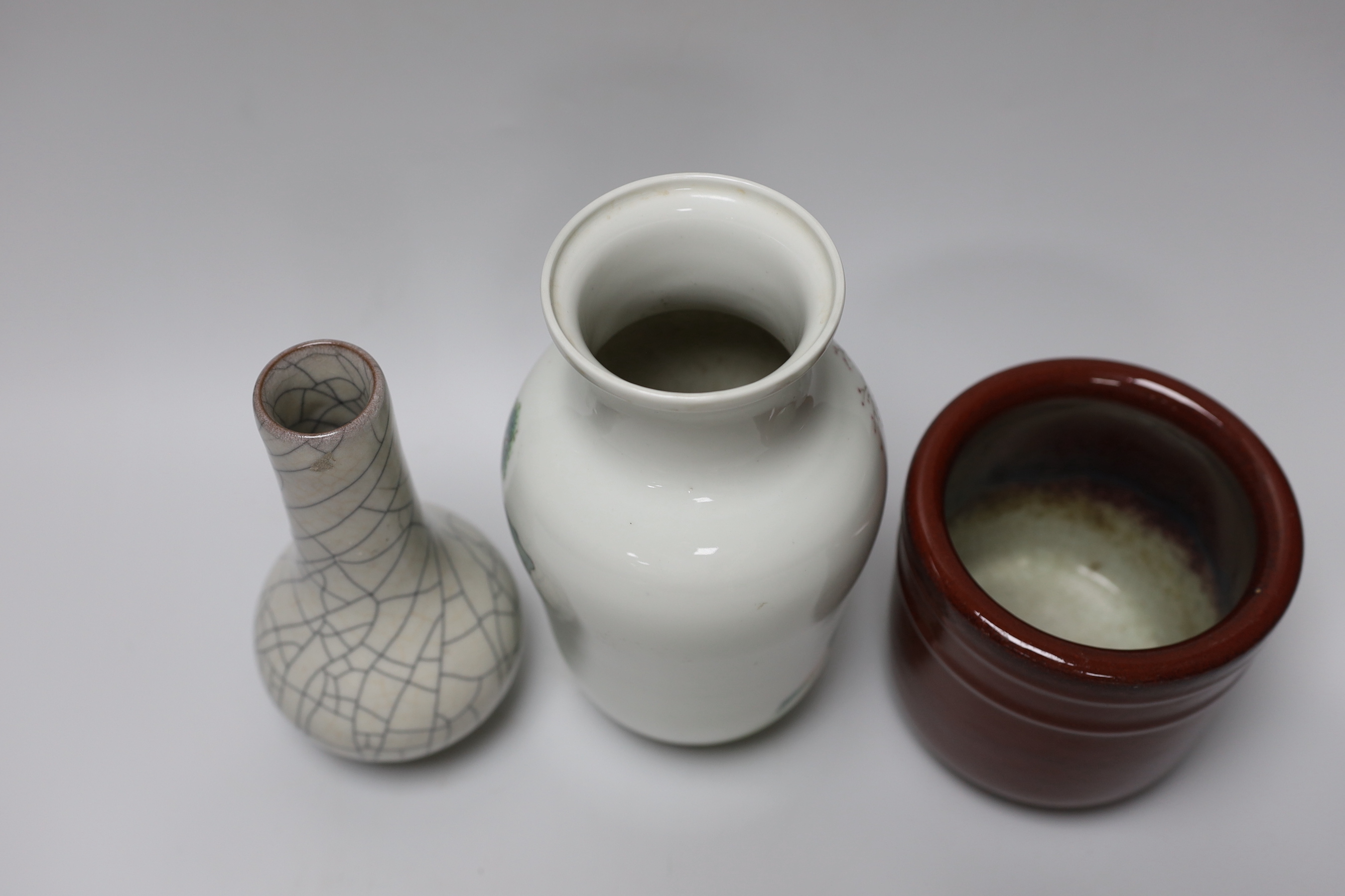 A Chinese famille rose vase, a crackle glaze vase and a sang de boeuf jar, tallest 21.5cm